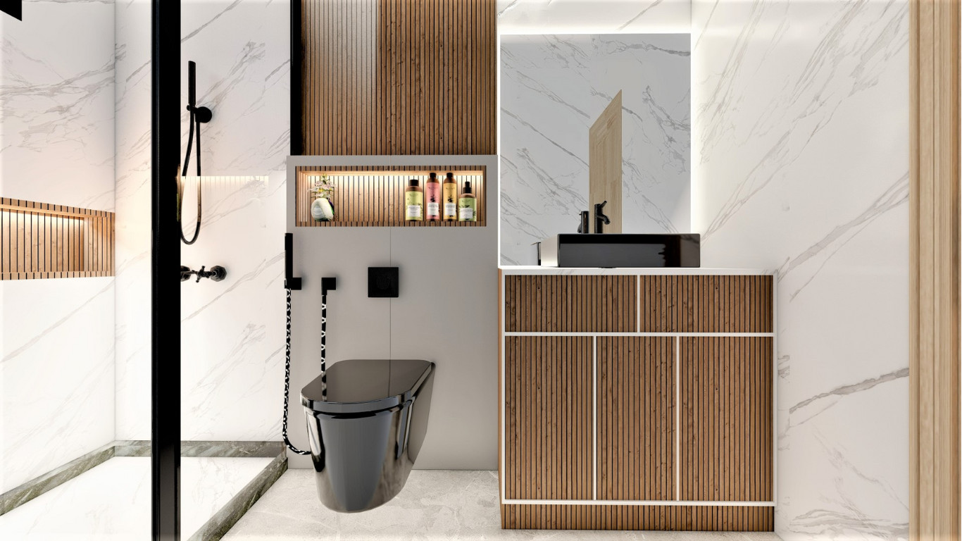 Shower area with black fixtures, wood accent niche and marble tiles.