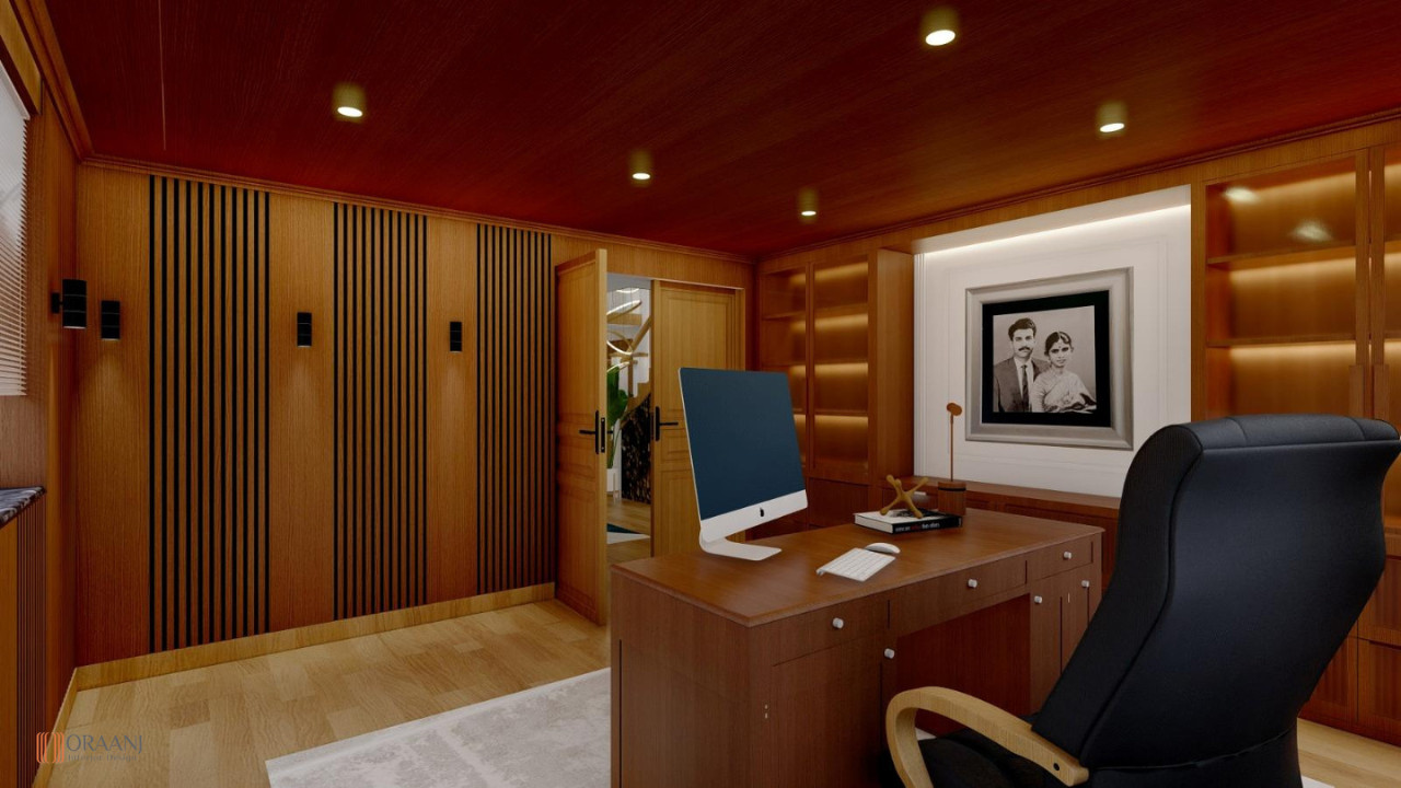 Formal traditional office with carved mahogany workstation featuring ornate details, premium black leather executive chair with button tufting, vertical wood wall cladding with slat construction providing elegant backdrop, classic wooden storage cabinets with traditional craftsmanship, wooden bookcase units with display shelving, classic ceiling-mounted lighting with recessed downlights, warm wood color scheme in brown tones, white coffered ceiling with architectural detailing, tall windows with white shade treatments, soft beige carpeting, wall-mounted artwork in classic frames, vintage decorative accessories and office items, antique wooden furniture with period styling, luxury executive workspace design, professional business environment, enduring elegant aesthetic with formal character, oak hardwood accents, high-end office furnishings, intellectual atmosphere with book collection display, and traditional design interior in East Ham