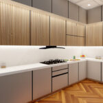 Thumbnail of http://Elegant%20sophisticated%20kitchen%20featuring%20grey%20minimalist%20flat-front%20lower%20cabinets,%20white%20natural%20stone%20marble%20countertops%20and%20splashback,%20illuminated%20vertical%20wood%20slat%20upper%20storage%20units%20with%20warm%20LED%20accent%20lighting,%20chevron%20herringbone%20wood%20floor%20pattern,%20high-end%20integrated%20gas%20cooking%20surface%20and%20oven,%20double-door%20refrigerator%20unit,%20modern%20undermount%20sink%20fixture,%20seamless%20handleless%20cabinetry,%20refined%20neutral%20color%20scheme,%20and%20luxurious%20culinary%20workspace%20in%20Reigate%20home.