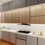 Thumbnail of http://Luxurious%20timeless%20kitchen%20design%20featuring%20grey%20handleless%20flat-front%20cabinetry%20system,%20white%20marble%20countertops%20and%20backsplash%20finishes,%20natural%20wood%20vertical%20slatted%20upper%20units%20with%20integrated%20ambient%20lighting%20strips,%20herringbone%20pattern%20timber%20flooring%20in%20warm%20tone,%20premium%20stainless%20steel%20gas%20range%20and%20oven,%20built-in%20refrigerator%20freezer,%20modern%20undermount%20sink%20with%20black%20mixer%20tap,%20sleek%20minimal%20hardware,%20sophisticated%20grey%20white%20and%20wood%20palette,%20and%20elegant%20functional%20cooking%20space%20in%20Reigate%20luxury%20property.