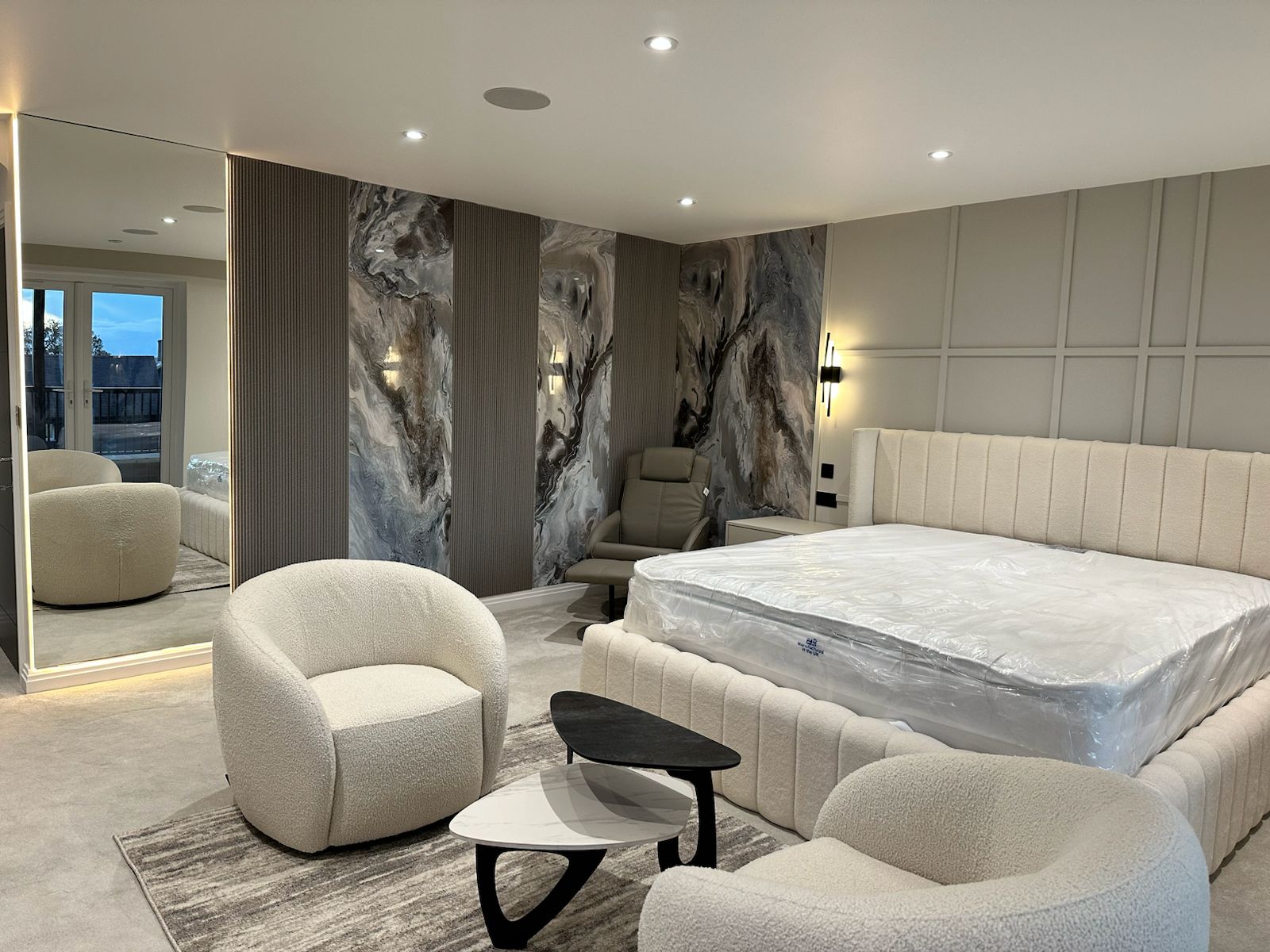 Contemporary Mayfair bedroom with bespoke cabinetry and integrated storage solutions
