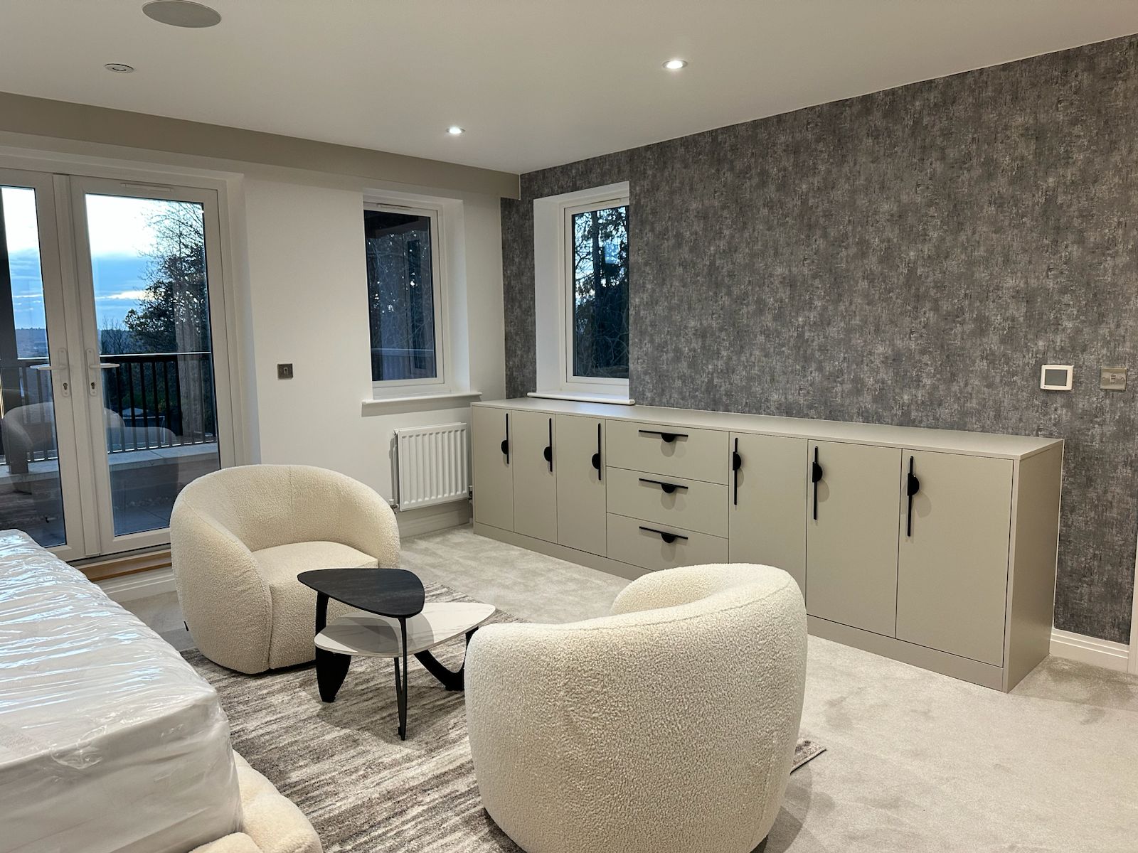 Hotel-inspired bedroom retreat in Mayfair with layered textures and soft lighting