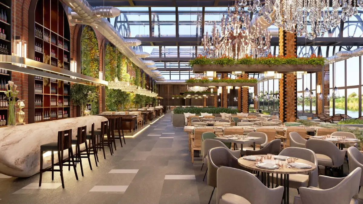 A modern, luxurious restaurant interior in London designed by Oraanj Interior Design, featuring elegant chandeliers, greenery, and a stylish bar area.